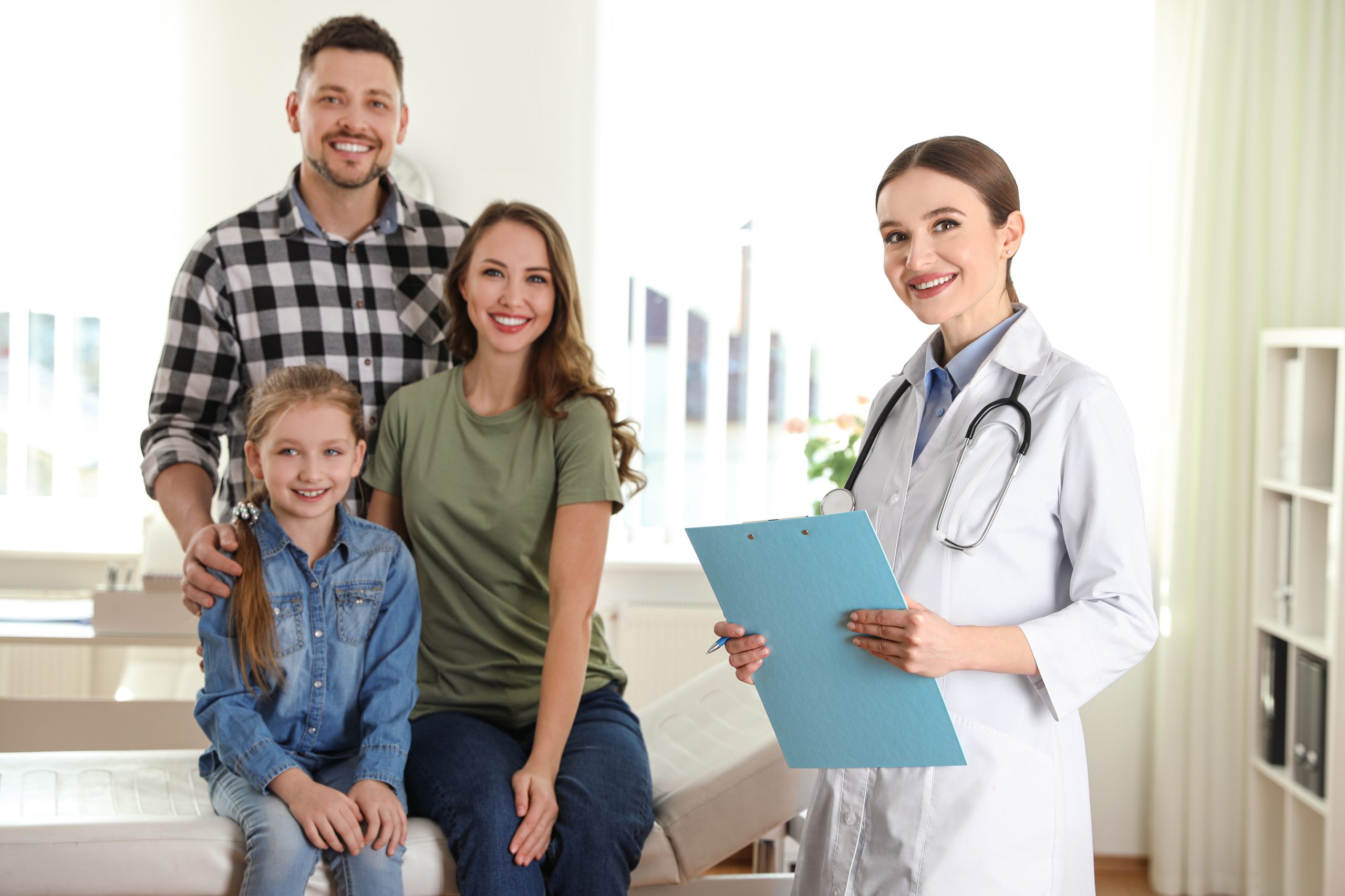 Family doctor visit Doctor speaking with a family in an examination room